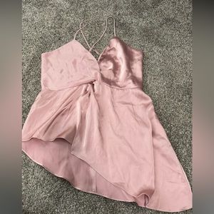 Size medium tank from Express. Sliky light pink. Side angle cut on bottom.